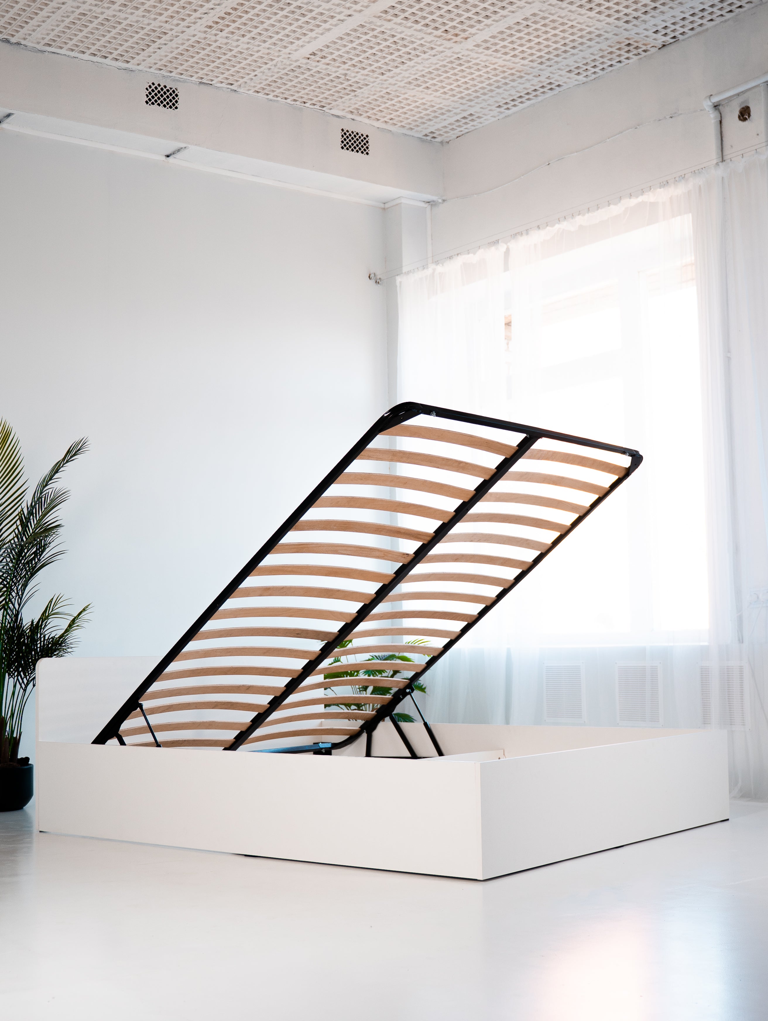 Łóżko 140x200 z podnośnikiem i pojemnikiem na pościel