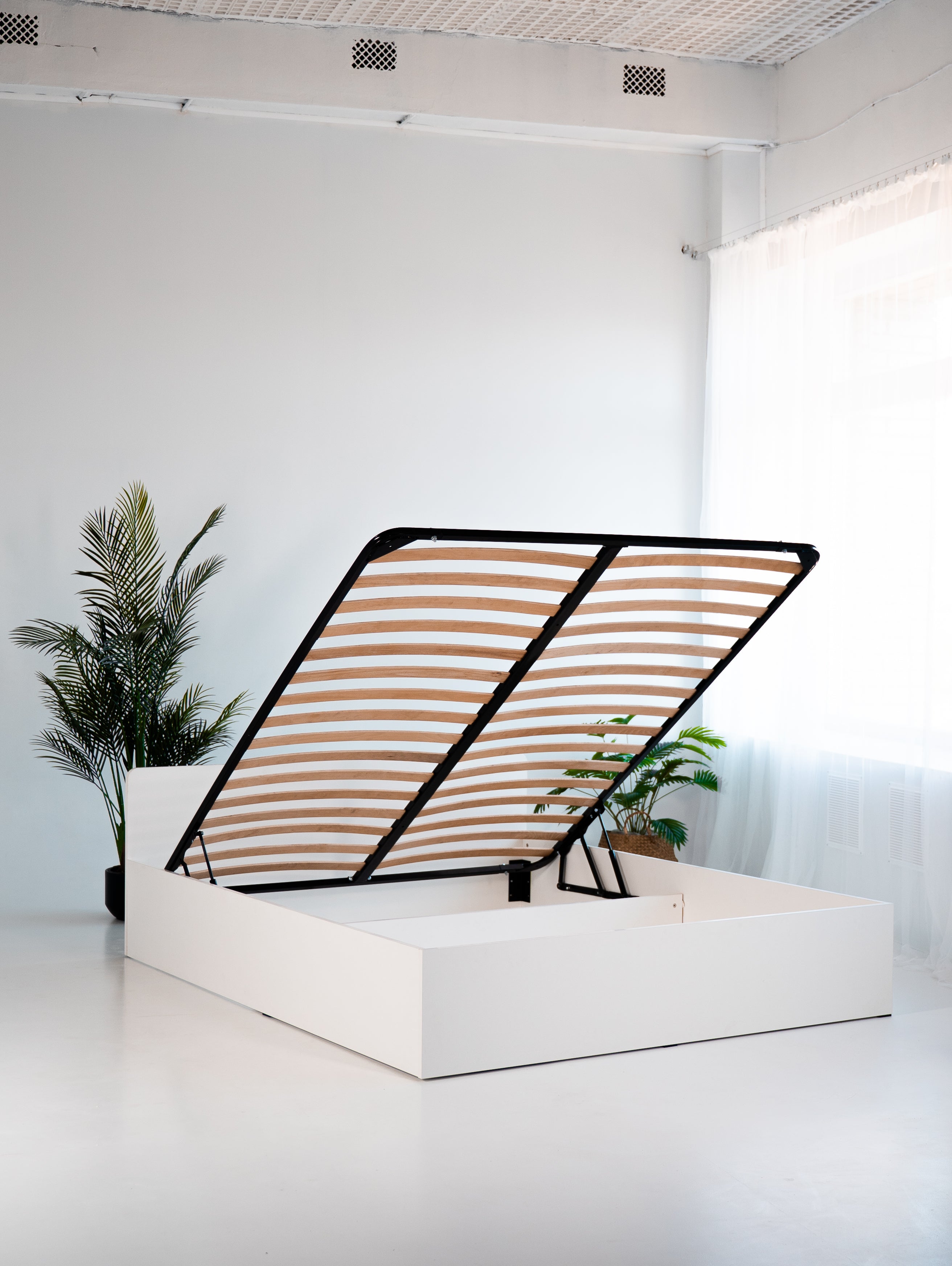 Łóżko 180x200 z podnośnikiem i pojemnikiem na pościel biały